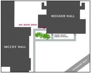 Outline of Wegner Hall next to Mccoy Hall with book drop labeled around corner and behind trees from main entrance