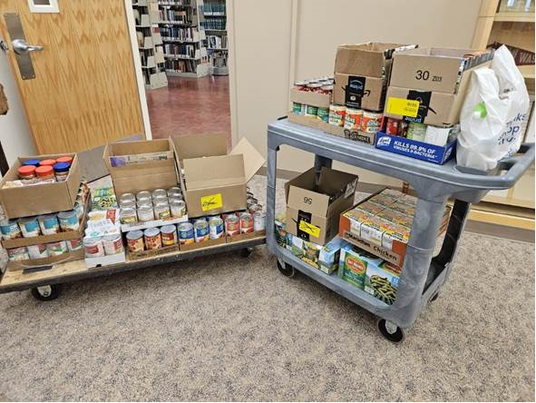 WSU Libraries donates 270 pounds of food to the Cougar Food Pantry. Photographed by Makenna Larson. 