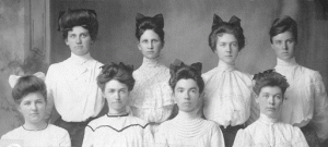 Eight graduate women students with hair bows