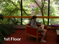 Image of a woman sitting on the third floor of the Owen Science and Engineering Library.